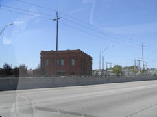 [Brick Building Seen Westbound on I-184]
