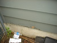 [Damage to Siding at Garage Right Front]