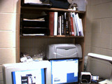 [Upper Half of My Desk, With All My Books]