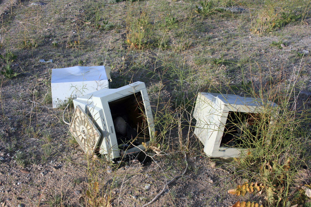 [Computer Graveyard. Someone had some fun with those CRTs.]